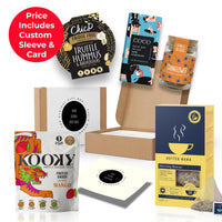 The Pick-Me-Up corporate gift box from the ethical gift box, presented in a co-branded box sleeve with Hottea Mama herbal tea, Isle of Skye dark chocolate and ChicP truffle hummus thumbnail